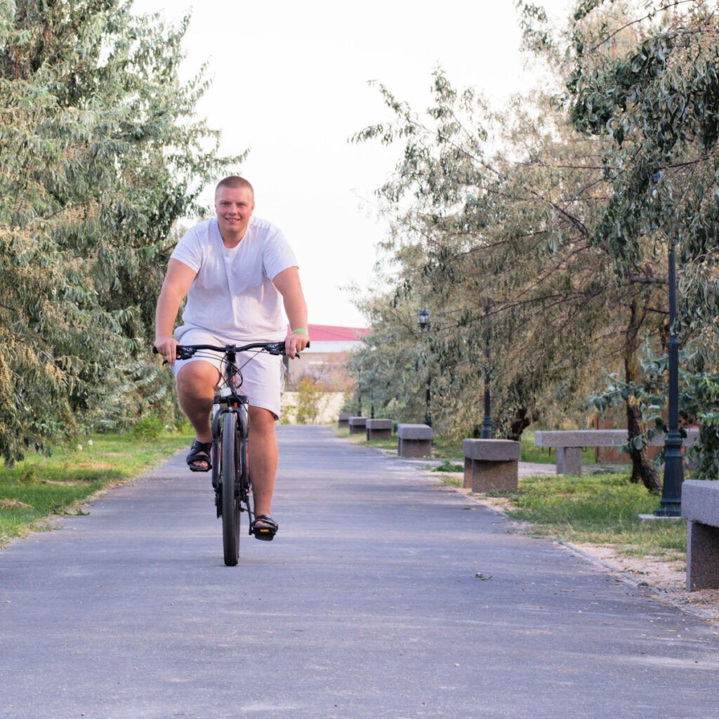 Confident man enjoying summer exercise after successful pre-summer weight loss using tips from Dr. Seun Sowemimo at Prime Surgicare.